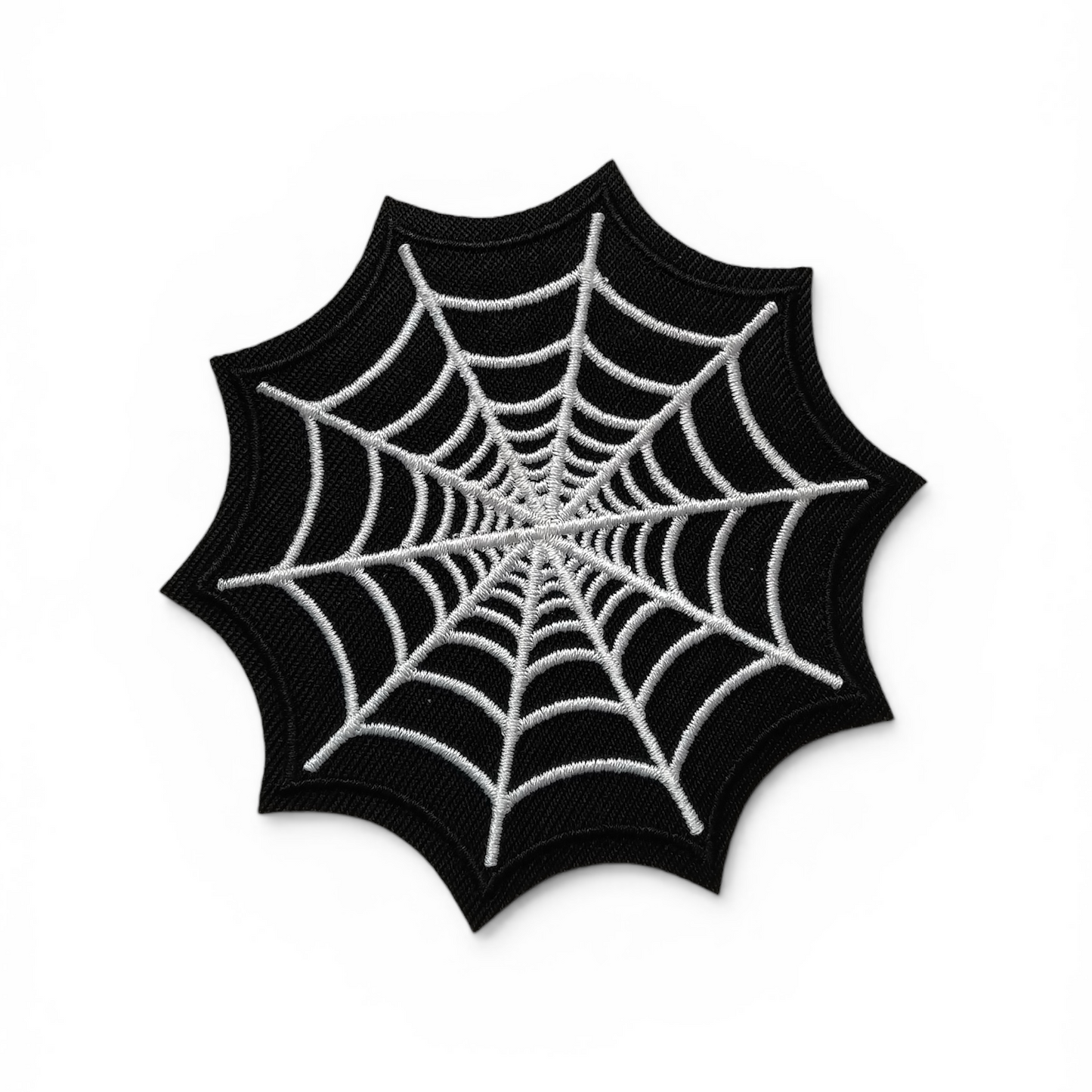 Black spider web design on a white background